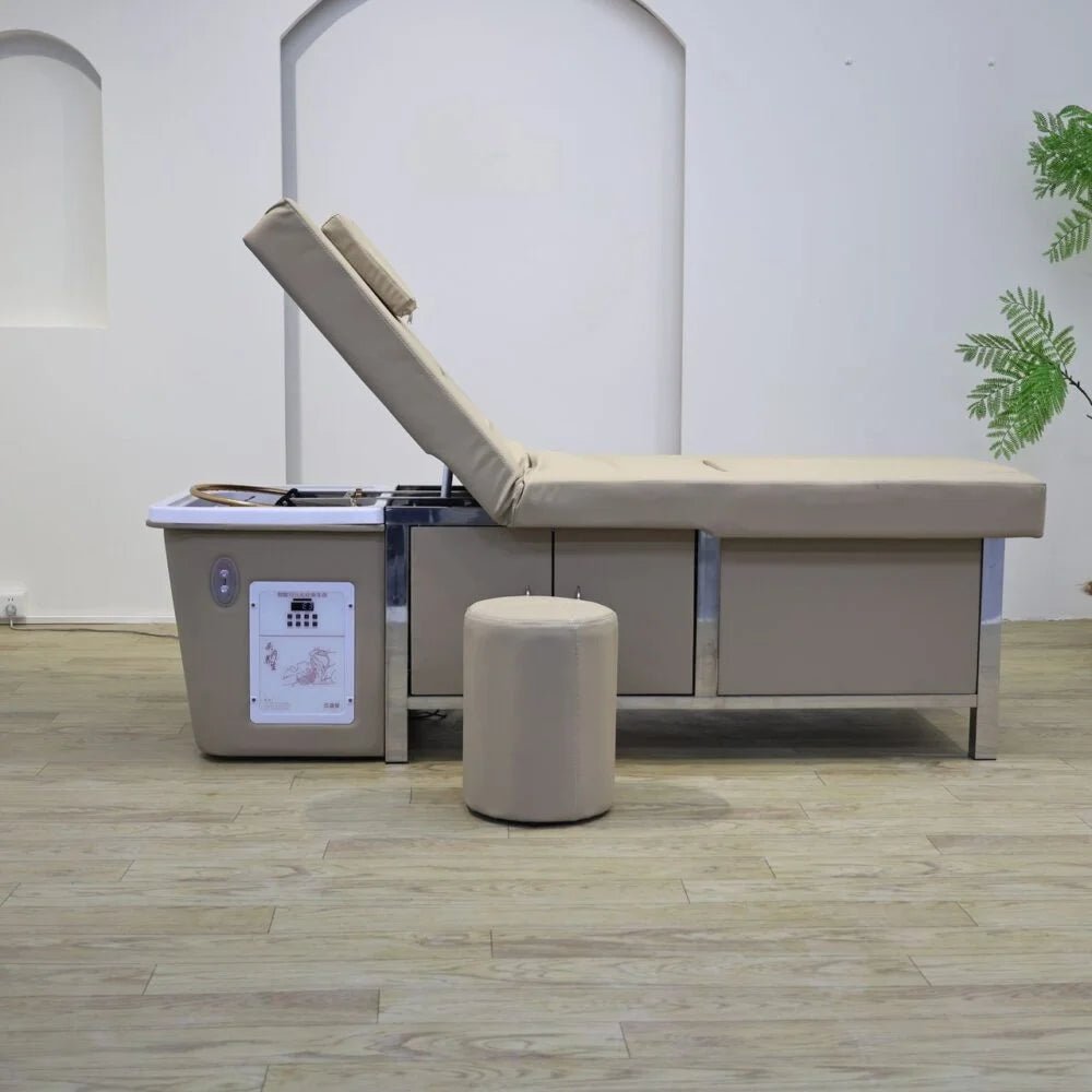 Side profile of the Aura Plus Reclinable Head Spa and Pedicure Bed, showcasing the elevated mechanical backrest, the exposed acrylic scalp washing basin at the head, and the integrated pedicure foot bath at the base, upholstered in premium PU vinyl with the matching stool. 