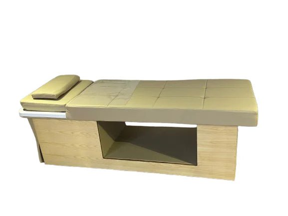 Side profile of the Botanica Woodgrain Plumbed Head Spa Table, featuring a natural wood-look chassis, taupe medical-grade vinyl cushioning, and a white acrylic washbasin equipped with a clear splash dome.