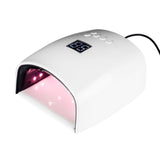 White Joiken 48W 2-in-1 LED/UV Gel Nail Lamp displaying a digital timer on top, featuring a wide ergonomic opening and removable grey base plate for pedicure and manicure access with LED lights on inside.