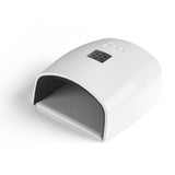 White Joiken 48W 2-in-1 LED/UV Gel Nail Lamp displaying a digital timer on top, featuring a wide ergonomic opening and removable grey base plate for pedicure and manicure access.
